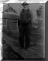 Clark McKee in front of coal shed, around 1921 - click for larger view